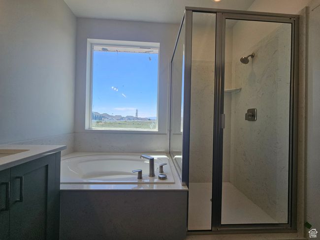 Full bathroom with a shower stall, a garden tub, and vanity | Image 18