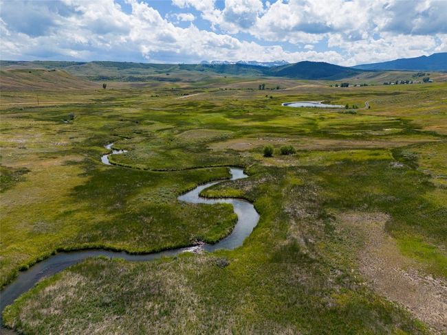 Drone / aerial view with a water and mountain view | Image 37