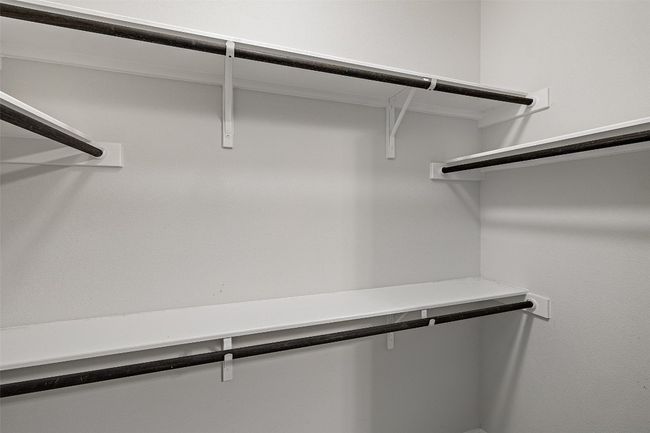 View of spacious closet | Image 15