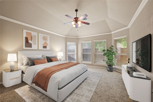 Bedroom with carpet, ornamental molding, a textured ceiling, a ceiling fan, and baseboards | Image 18