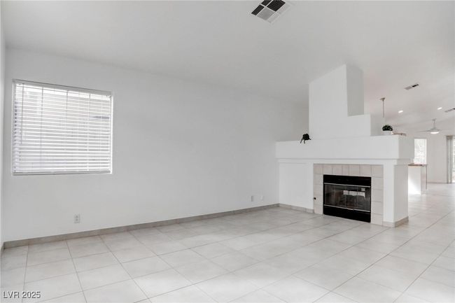 Living room featuring a fireplace | Image 4