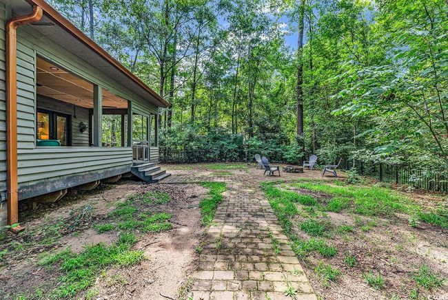 View of yard with an outdoor fire pit | Image 33