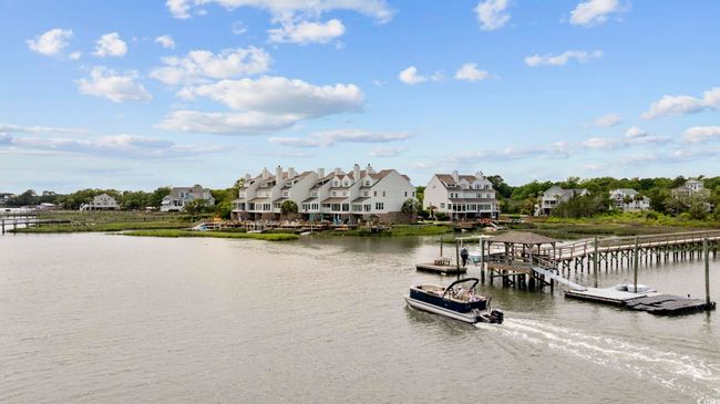 Dock area featuring a water view and a residential view | Image 16