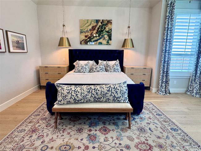 Bedroom with light wood finished floors and baseboards | Image 21