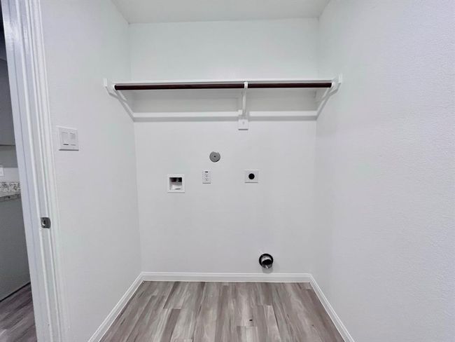 Convenient utility room with washer and dryer hookups. Virtually staged for inspiration. | Image 23