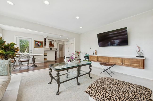 Living room featuring recessed lighting, light wood-style flooring, and baseboards | Image 15