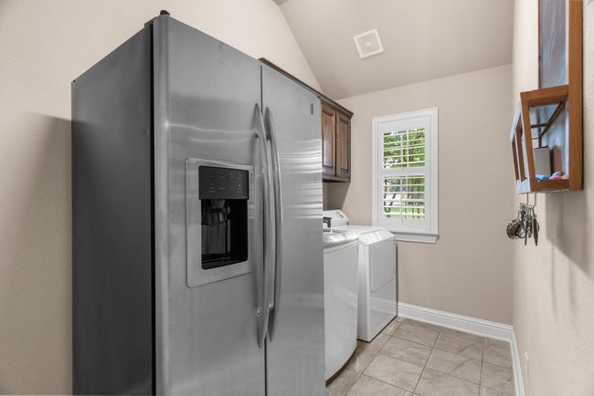 Off kitchen and garage. | Image 37