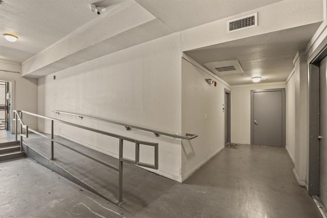 Hall with concrete floors and baseboards | Image 20