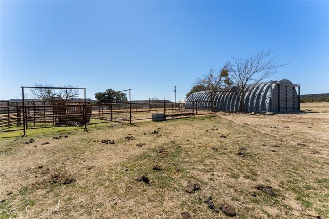 View of yard with a rural view, an outdoor structure, and fence | Image 19
