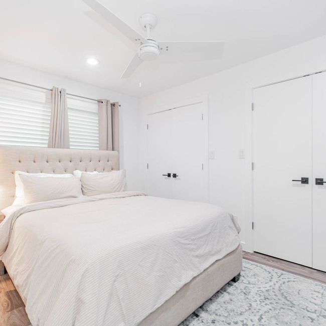 Bedroom featuring light wood-style flooring, ceiling fan, and recessed lighting | Image 11
