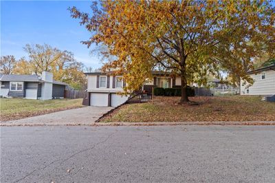 View of front of house featuring a garage and a front yard | Image 3