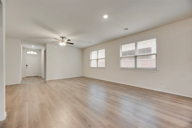 Spare room with ceiling fan, light wood-style floors, baseboards, and recessed lighting | Image 15