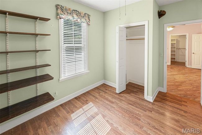 Unfurnished bedroom featuring light wood-style floors and a closet | Image 28
