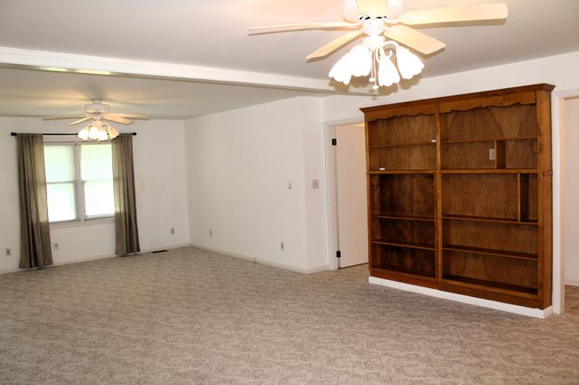 Beautiful wood built in shelving in the family room!! Simple touch of elegancy that adds extra character and makes this house feel like a home immediately!! | Image 10
