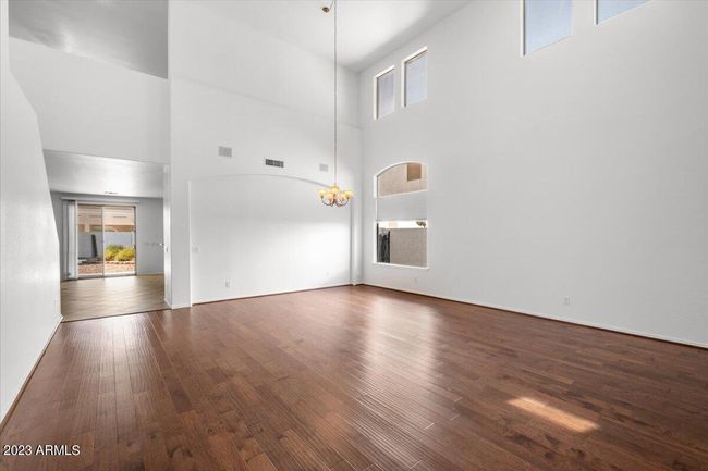 Inviting entry to formal living room, neutral paint and natural light | Image 3