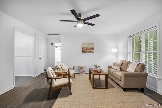 Living room featuring wood finished floors, plenty of natural light, baseboards, and ceiling fan | Image 32