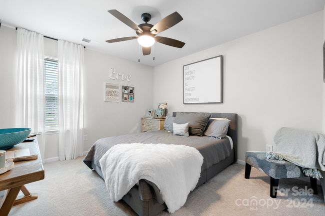 Bedroom #2 has soft carpeting, ceiling fan and nice sized closet. | Image 22