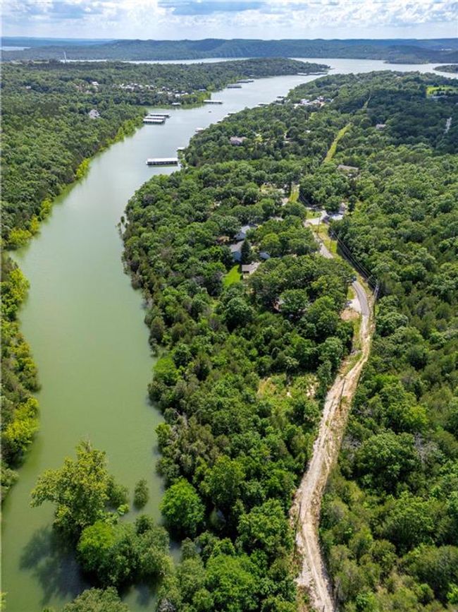 Bird's eye view of a nearby body of water and a forest | Image 11