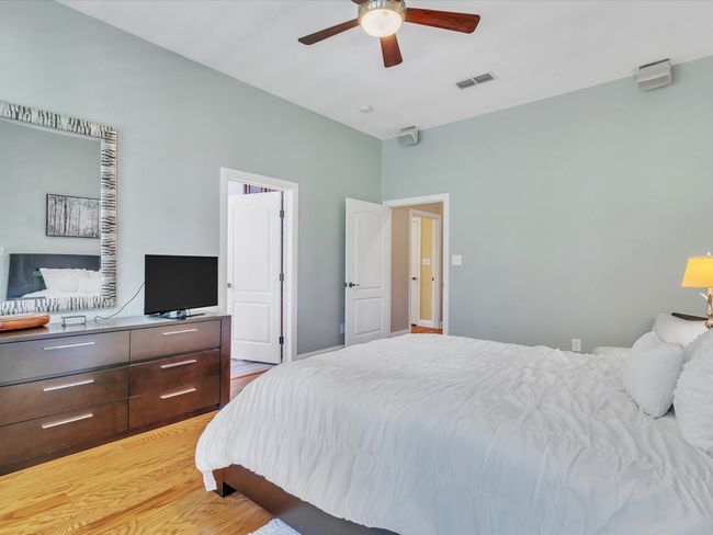 Bedroom featuring light wood-style floors and a ceiling fan | Image 18