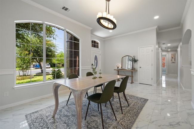 Formal Dining space featuring light marble finish flooring, recessed lighting. | Image 8