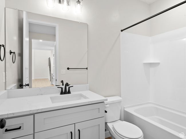 Full bath with toilet, shower combination, and vanity | Image 14