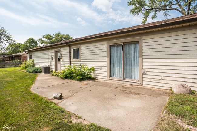 back of house featuring a patio and a yard | Image 39