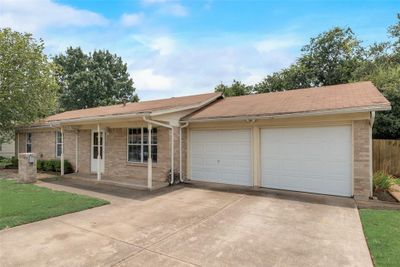 Ranch-style house featuring a garage | Image 2