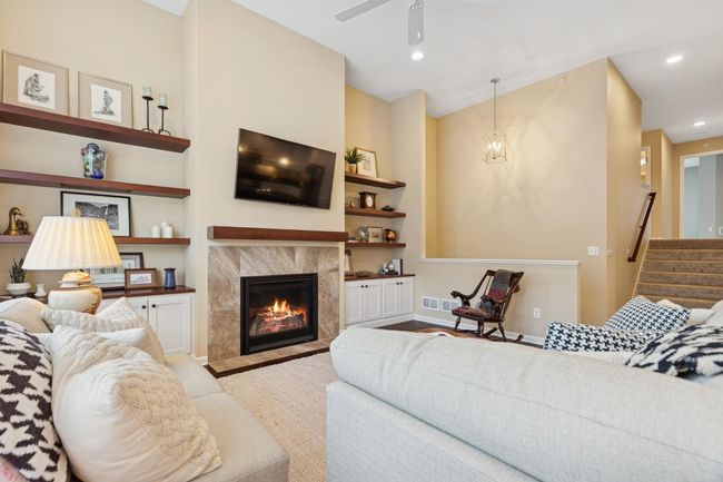 So warm & inviting! This alternate view also shows access to the upper level. | Image 6