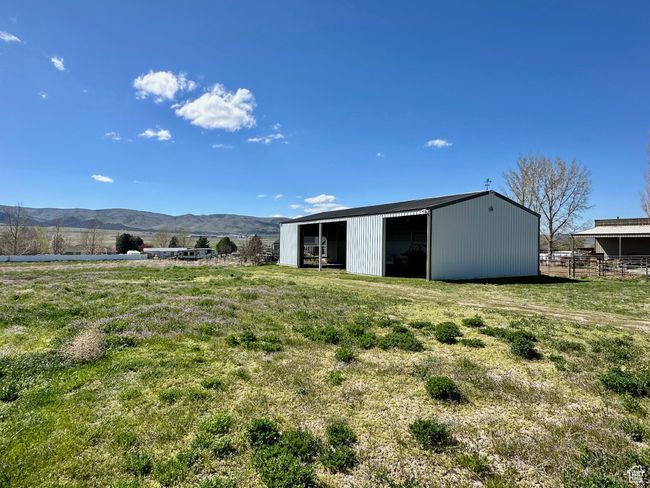 Exterior space with a mountain view, a rural view, and an outdoor structure | Image 6