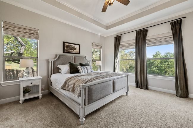Bedroom featuring baseboards, carpet flooring, and multiple windows | Image 15