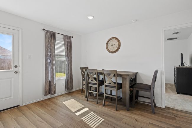 Dining room with visible vents, baseboards, and wood finished​​‌​​​​‌​​‌‌​‌‌​​​‌‌​​‌‌​‌​​​​​‌ floors | Image 4