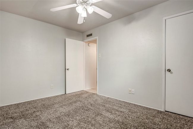 Carpeted spare room with ceiling fan | Image 29