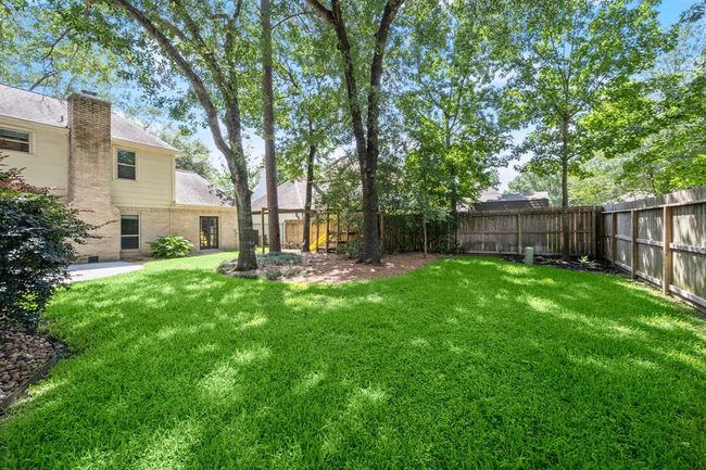 Backyard offers the perfect size for play and is beautifully shaded, creating a comfortable space for all-day activities and relaxation. | Image 35