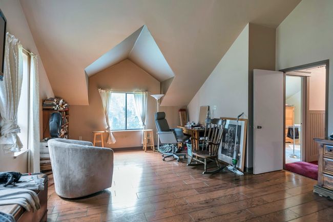 Office area with wood finished floors and vaulted ceiling | Image 25