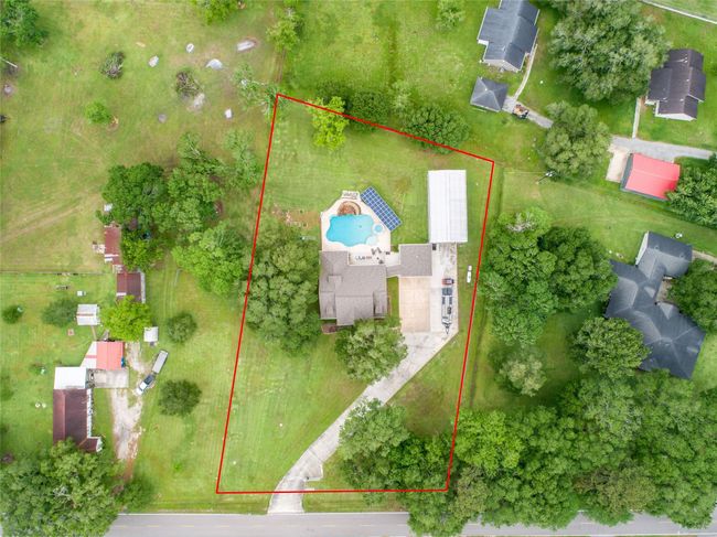 Tucked away on 1.5 serene acres in Manvel, this distinctive property is built for the way you want to live. The flexible floorpan allows between 4 to 6 bedrooms, 2.5 baths, a 2-car garage, in-ground pool, plus a 60'x30' insulated shop. | Image 5