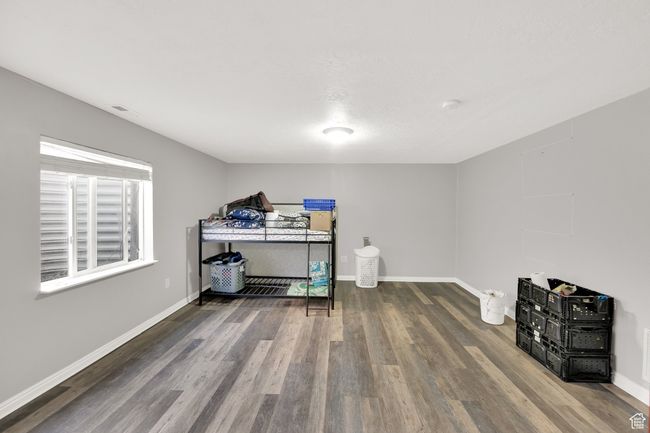 Bedroom featuring wood finished floors and baseboards | Image 17