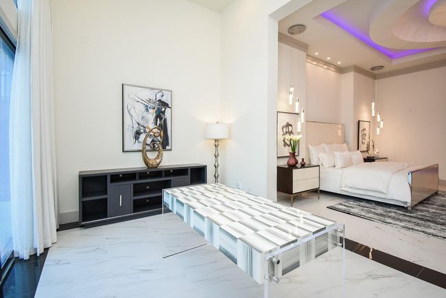 Large living area in the primary bedroom with access to the backyard, can be utilized as a sunroom. | Image 24