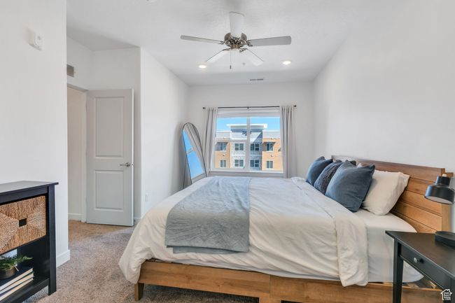 Carpeted bedroom featuring ceiling fan | Image 9