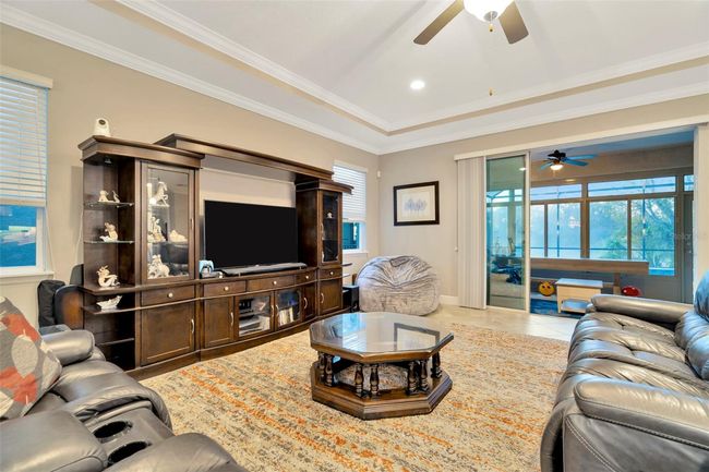 Great Room with Tray Ceiling overlooking Lanai & Pool | Image 6