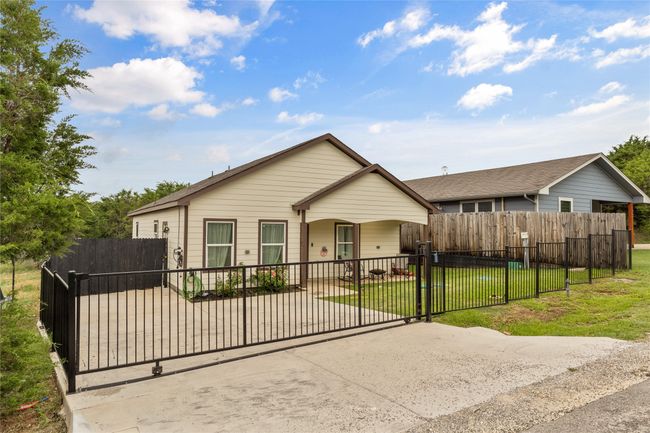 View of front of home with a gate | Image 7