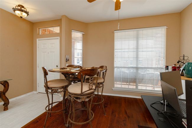 Dining room featuring baseboards, light wood finished floors, and ceiling fan | Image 7