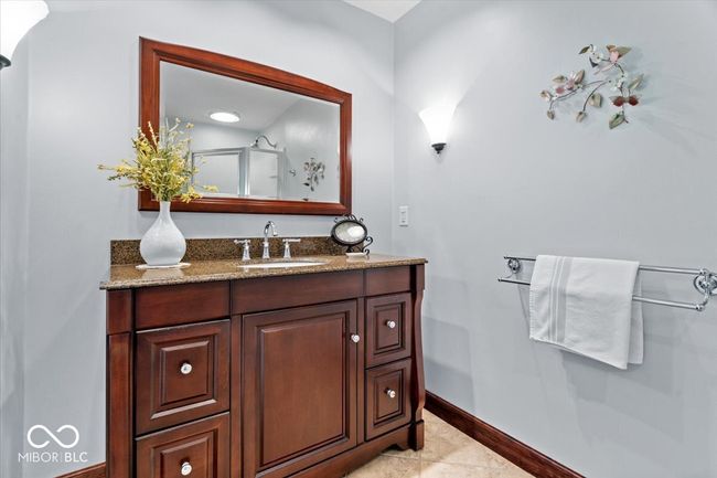 full bath featuring vanity, tile patterned floors, and a shower | Image 25