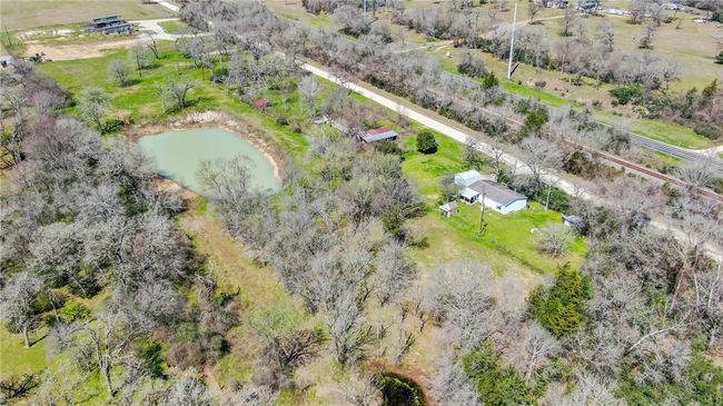 View of rural area featuring a nearby body of water | Image 15