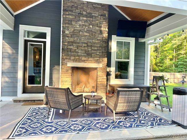 View of patio / terrace with an outdoor living space with a fireplace | Image 41