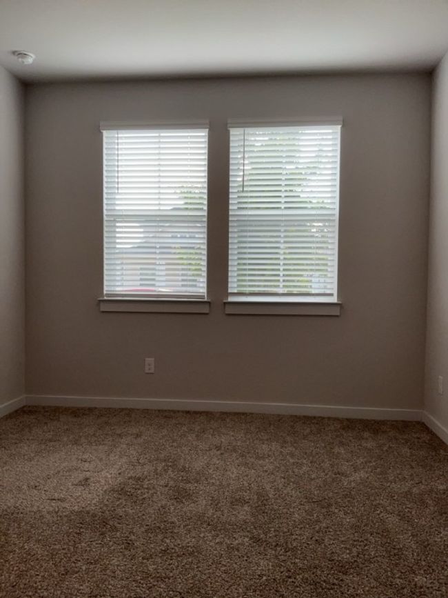 Carpeted empty room featuring healthy amount of natural light | Image 28