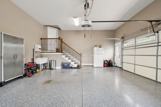 ... Extra nice staircase with stained and finished wood treds and wood landing, Extra High Ceilings for added storage if desired, & refrigerator remains. | Image 64