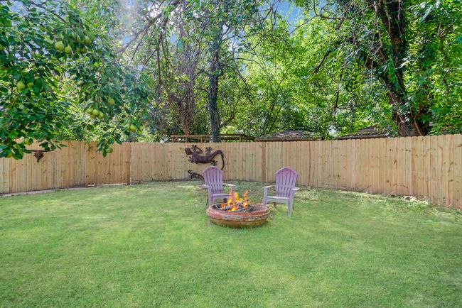 View of fenced backyard | Image 25