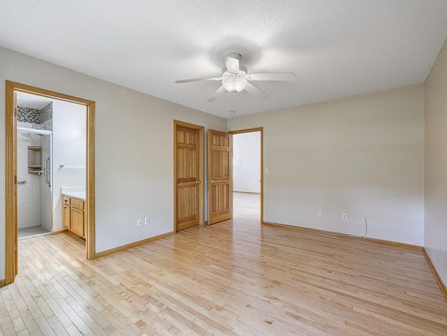 The primary suite includes a 3/4 bath and walk-in closet. | Image 13
