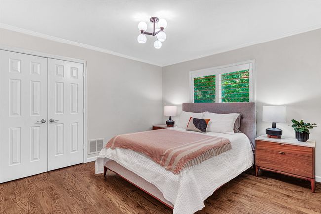 Another guest bedroom has updated light fixture and is adjacent to the full bath shared by the game room. | Image 30