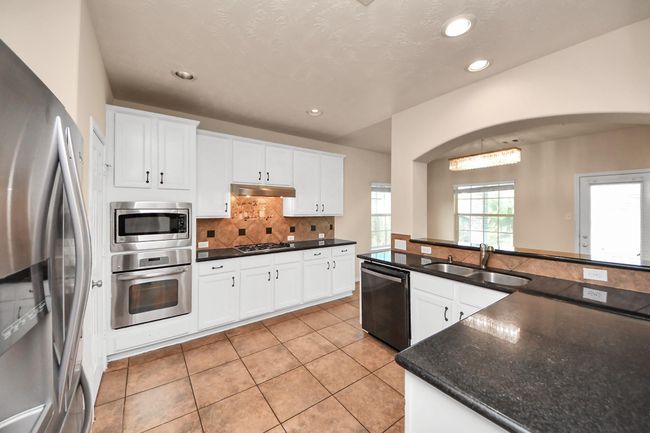 14311 Lakepointe Bend Ln, House other with 6 bedrooms, 4 bathrooms and 2 parking in Cypress TX | Image 16